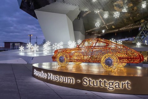 Highlights on Porscheplatz in Zuffenhausen. In front of the Porsche Museum and the car