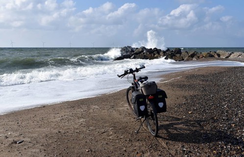 Bicycle and breakwater on the North Sea beach in Denmark
