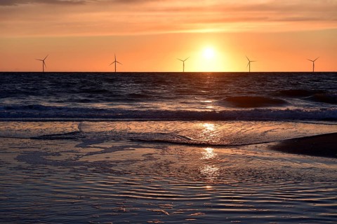 Sunset behind wind turbines in the Danish North Sea