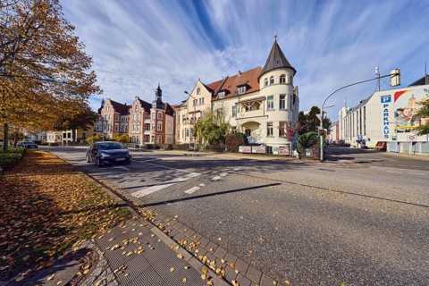 Historic residential buildings, turrets, balcony, façade with windows, Contipark parking garage Am