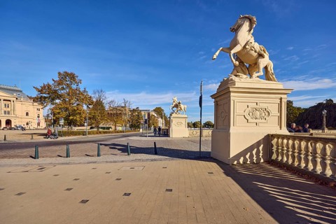 Castle bridge, entrance portal, horse sculpture, car bridge and footbridge, sidewalk, sandstone