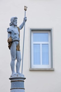 Fountain and Neptune with trident sculpture, Roman water god, Neptune fountain, market square,
