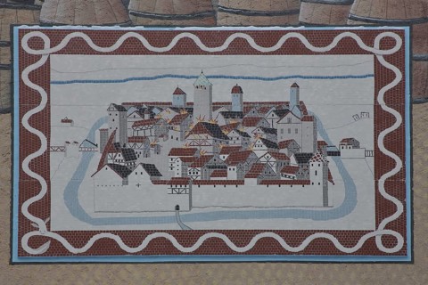 Historical wall by artist group Kollektiv K 2020, wall mosaic with historic city fire, cityscape