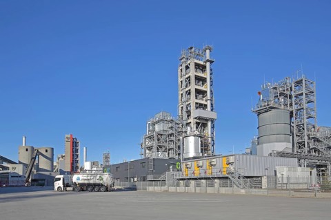 Schwenk cement factory industrial plant with silos and blast furnace, towers, truck, cement