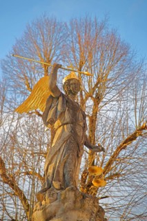 Justice as an angel and golden crown with cross, spear and beam scale, golden wings, symbol of