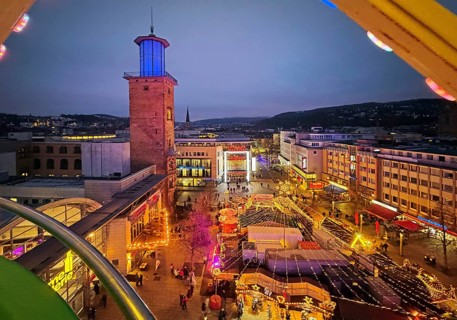 View of the town hall tower with the Christmas market from a Ferris wheel gondola, Hagen, Ruhr