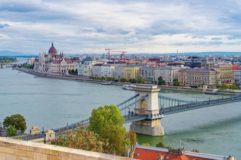 Hungarian parliament along the Danube River and Chain Bridge, Budapest, Hungary