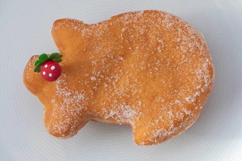 Traditional lucky pig cake served on a plate, as a sweet New Year's pastry and symbol of good luck