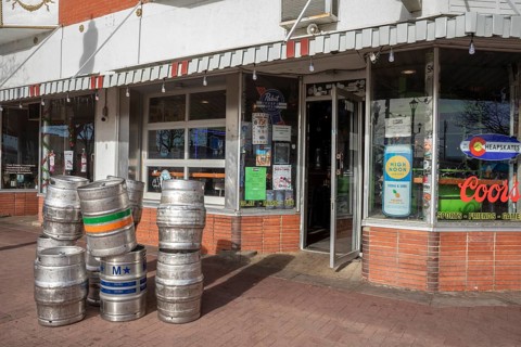 Arvada, Colorado - Empty beer kegs stacked outside Cheapskates sports bar in Olde Town Arvada