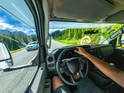 Pov driving a vehicle on the scenic icefields parkway in the canadian rockies with mountains and