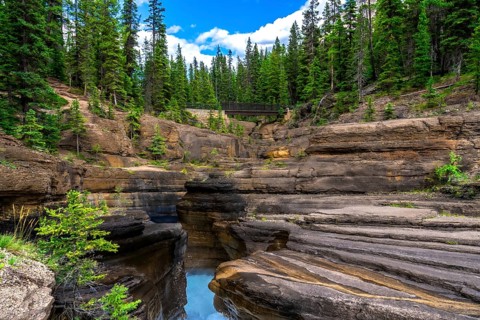 Water flowing through mistaya canyon in banff national park, alberta, canada, creating a stunning