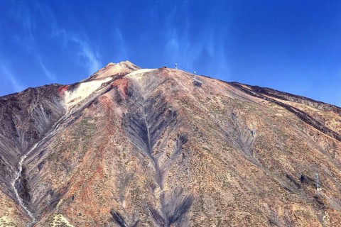 Close-up of Pico del Teide peak under blue sky, Pico del Teide National Park, La Orotava Tenerife