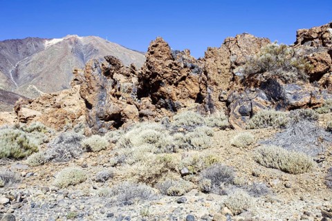 Rock structures in a bare area with views of mountains, Pico del Teide National Park, La Orotava