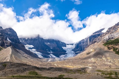 Athabasca glacier, part of the columbia icefield, reveals its shrinking beauty against the rugged