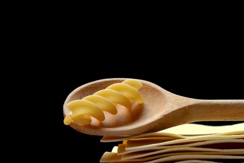 Lasagna, lasagna sheets and cooking spoon with fusilli noodle, spiral noodle, type of pasta