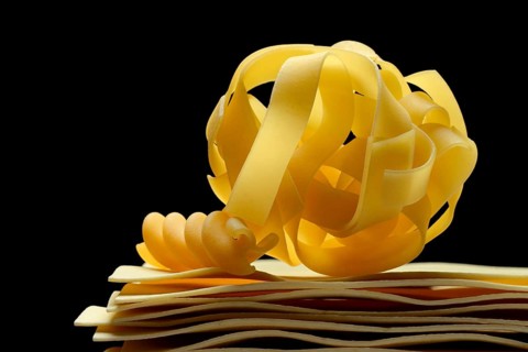 Uncooked lasagna sheets, fettuccine and fusilli