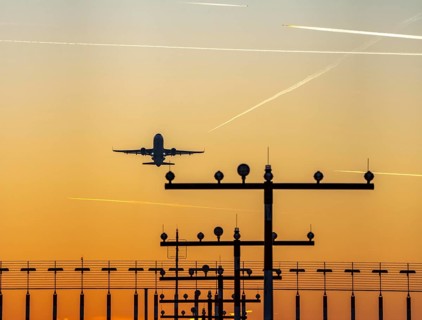 Runway lighting, approach aids, at Düsseldorf International Airport, sunset, aircraft taking off,