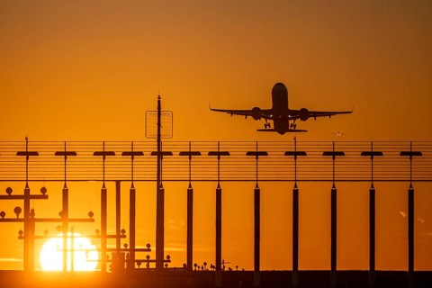 Runway lighting, approach aids, at Düsseldorf International airport, sunset, aviator taking off, in