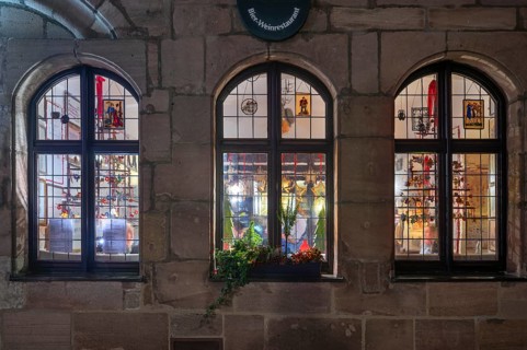 View through the windows of the historic restaurant, Albercht Dürer Stuben, in the old town with