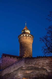 Sinwell tower illuminated in the evening, built in the 13th century, Kaiserburg, Nuremberg, Middle