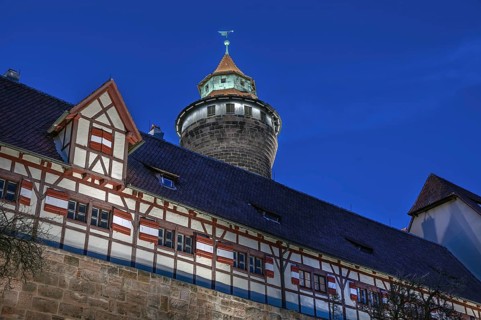 Sinwell Tower built in the 13th century, on the Nuremberg Kaiserburg in the evening lighting, blue
