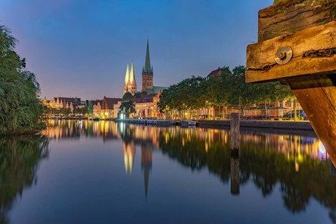 Old town with St. Mary's Church and St. Peter's Church and the Trave at dusk, Lübeck,