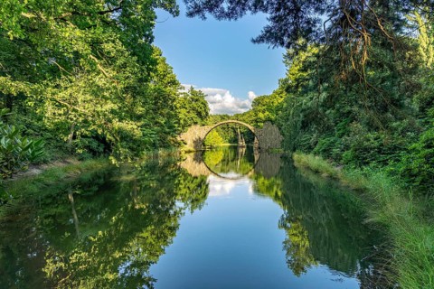 The Rakotz Bridge or Devil's Bridge on Lake Rakotz in the Kromlau Azalea and Rhododendron Park,
