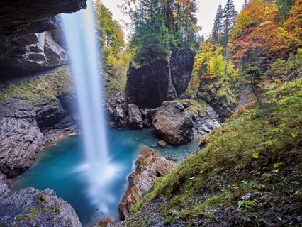 Waterfall mountain list in autumn-colored surroundings, Linthal, Klausenpass, Canton of Glarus,