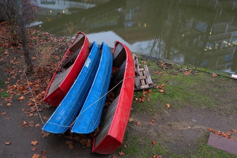 Assembled rowing boats on the banks of Pegnitz, river in Nuremberg, Middle Franconia, Bavaria,