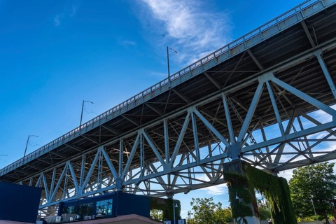 Granville street bridge standing tall against vibrant blue sky, showcasing its impressive steel