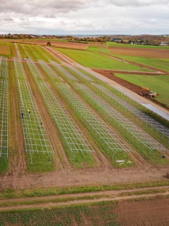 Start of a solar plant in fields with technical structures and a green environment, energy