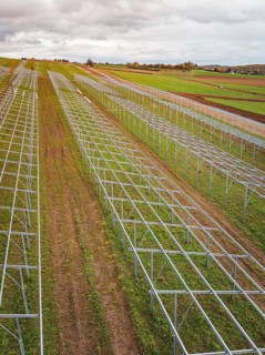 Structures of a solar plant during the construction phase on green fields, energy transition,