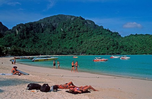People, boats on the beach of Ko Phi Phi Don, two years in front of the tsunami, Thailand, December