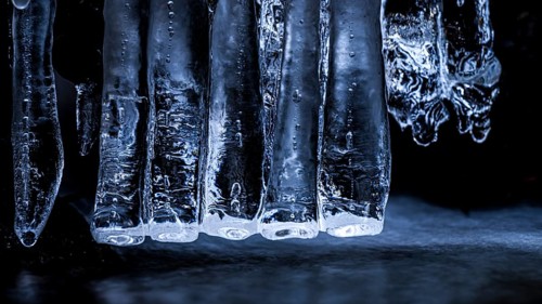 Close-up of blue icicles. Cool, frosty atmosphere reflecting the winter cold, Zwickenbach,