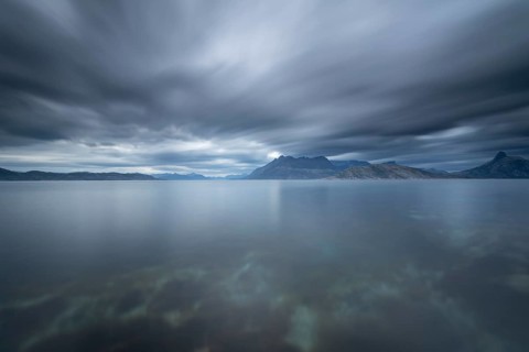 The Vestfjord in Nordland, Norway, near Bodø, impresses with a dramatic atmosphere. Dark clouds