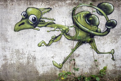 Grafity on an old wall, dilapidated plant of a former agricultural production cooperative of the