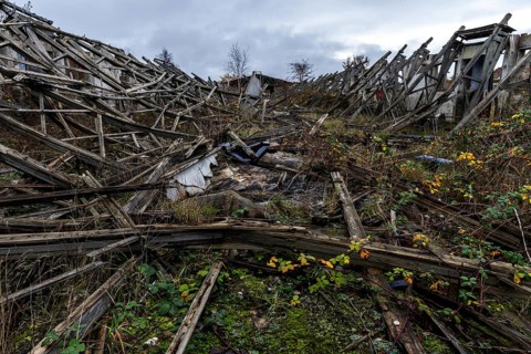 Dilapidated hall of the dilapidated plant of a former agricultural production cooperative of the
