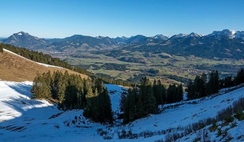 View from the Bolsterlanger Horn of villages in the Illertal and mountains of the Allgäu Alps,
