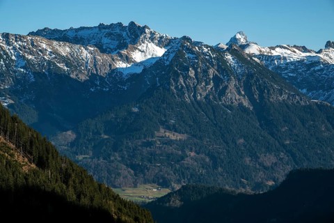 View from the high-altitude hiking trail from Bolsterlanger Horn to Riedberger Horn, snow-capped