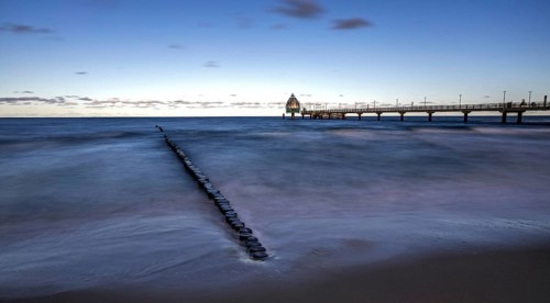 Groes and pier with diving gondola, panorama, long exposure, evening light, Zingst,