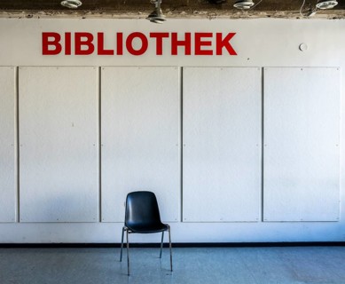 Empty chairs stand in front of access to a library, Berlin, Germany, which has been closed due to