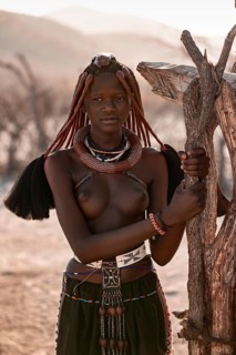 Young Himba woman with jewelry, portrait, traditional Himba village, Kaokoveld, Kunene, Namibia
