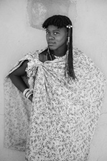 Black and white, portrait, brightly decorated woman of the Hakaona tribe, also Havakona or