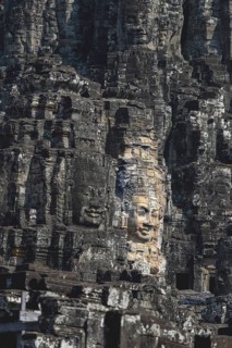 Huge stone-carved faces of Bodhisattva Lokeshvara, also Avalokiteshvara, Bayon Temple, Angkor Thom,