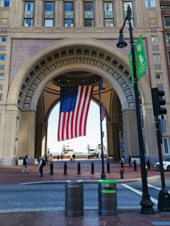American flag fluttering, distinctive archway, Boston Harbor Hotel, Rowes Wharf, Freedom Trail,
