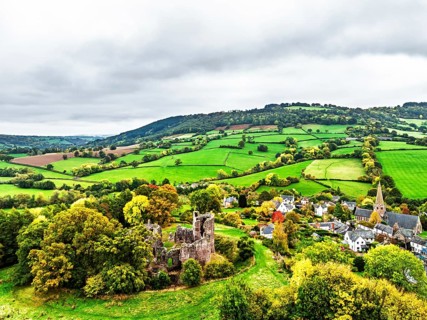 Autumn Colours over ruins of Grosmont Castle from a drone, Grosmont, Monmouthshire, Wales, UK