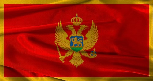 Flag of Montenegro with fabric textured background. Close up of National flag of Montenegro with