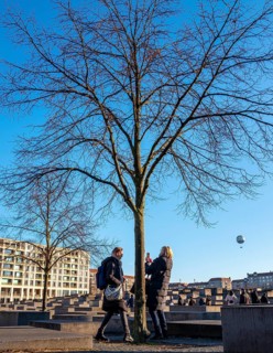 Tourists at the Memorial to the Murdered Jews of Europe, Behrenstraße, Berlin, Germany