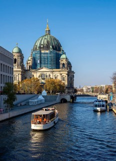 Sightseeing steamers and tourist ships on the Spree at Berlin Cathedral, Germany