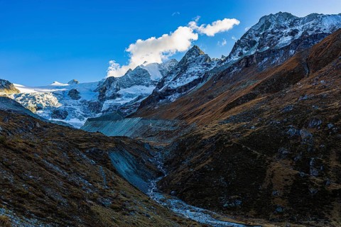 Clouds over the peaks of the Grand Cornier, Tete Blanche and Pointe Moiry mountains, Val